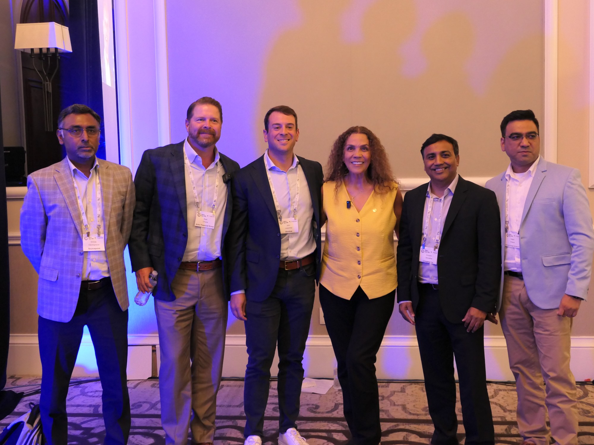Suha Beidas Zehl, CMB®, AMSP™ with fellow speakers at a mortgage AI conference