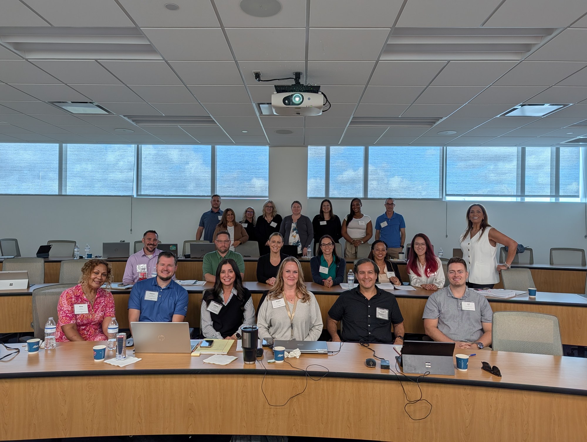 Suha Beidas Zehl, CMB®, AMSP™ with a full training room of mortgage professionals