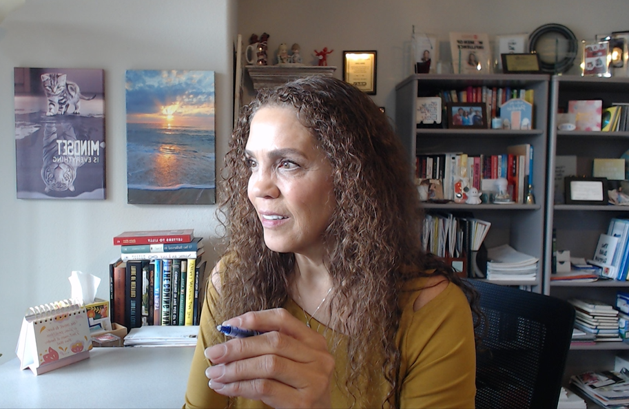 Suha Beidas Zehl, CMB®, AMSP™ working at her desk