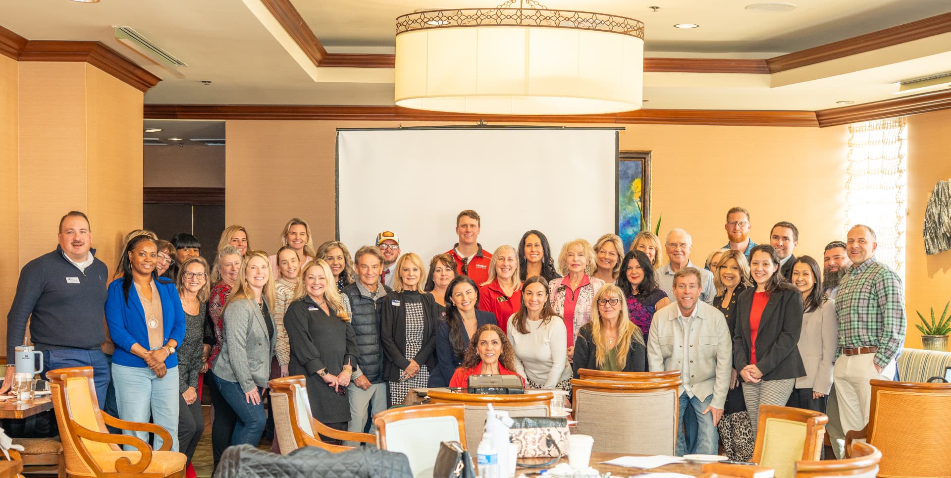 Suha Beidas Zehl with attendees after an industry event session